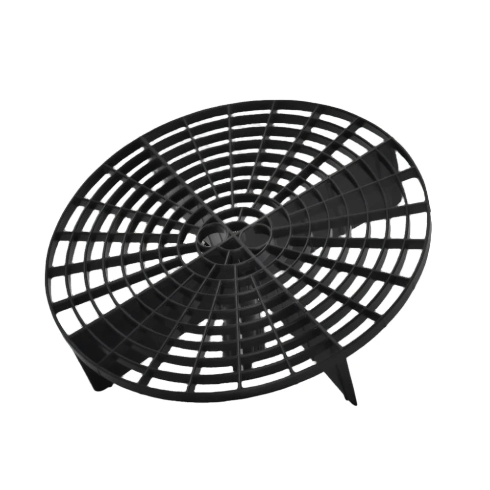 Black grit guard insert that sits in the base of a wash bucket