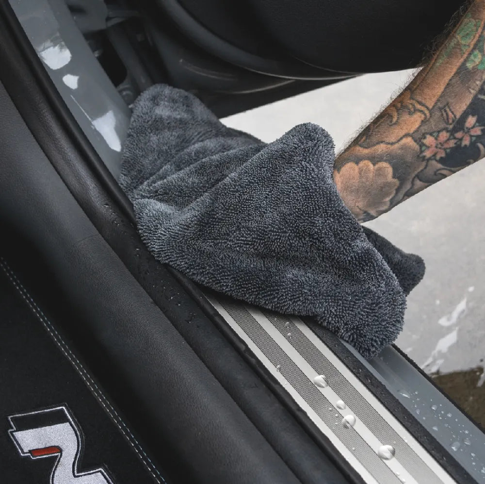 Dry Guy Mini towel drying a car door sill and shut line