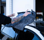 Drying a wet black car with the Dry Guy XL microfibre drying towel