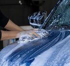 Washing a soapy car bonnet by hand with a Deluxe Detail microfibre wash pad