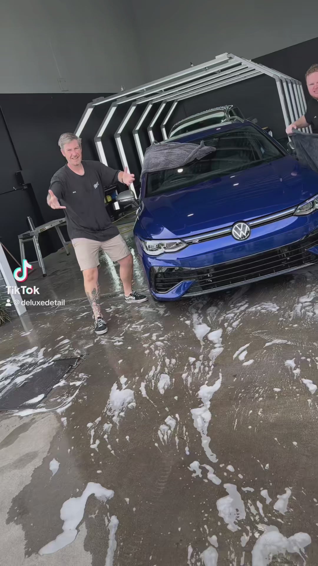 Comparing the XL and Mini Dry Guy drying towels while drying a blue Volkswagen Golf